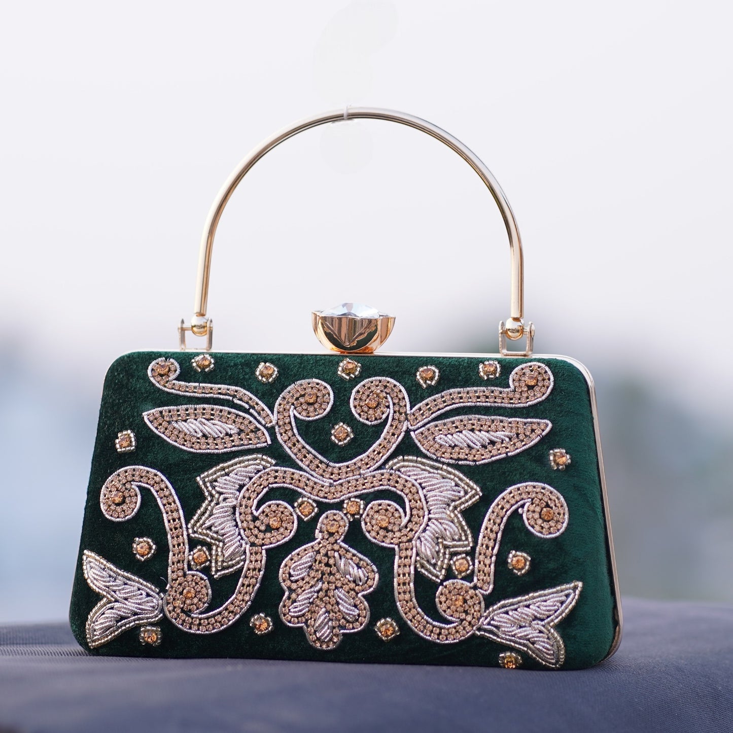 green designer clutch bag