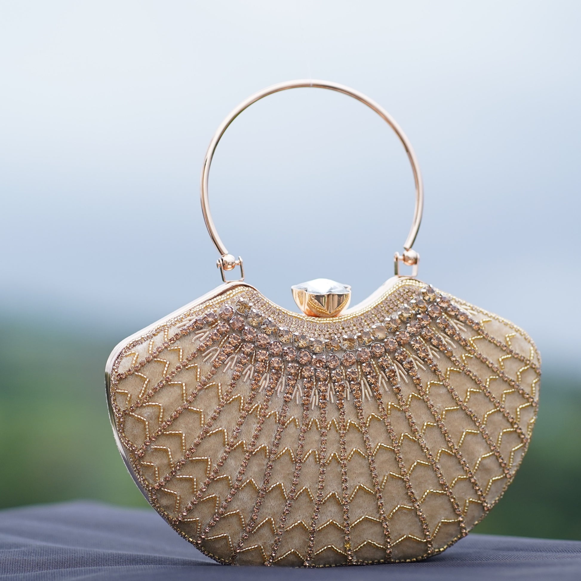 designer clutch with hand strap