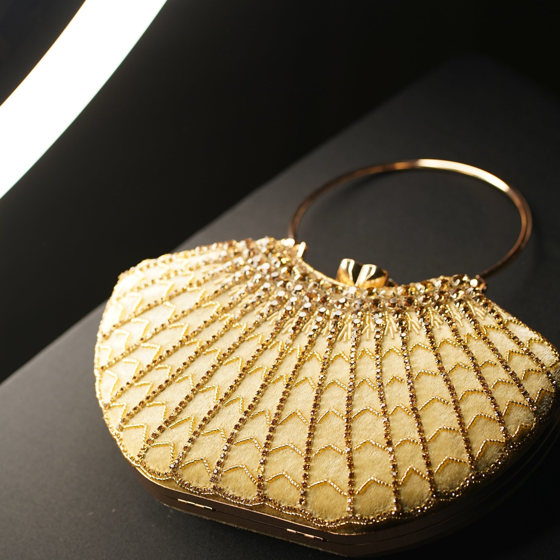 designer clutch with hand strap